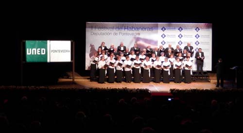 Hoy por la tarde el Teatro Municipal tudense acogía el II Festival de Habaneras de la Diputación de Pontevedra, patrocinado por el Centro Asociado a la UNED de Pontevedra, en el que participaron once corales de la provincia que interpretaron diferentes piezas musicales de este género y al que acudieron más de trescientas personas